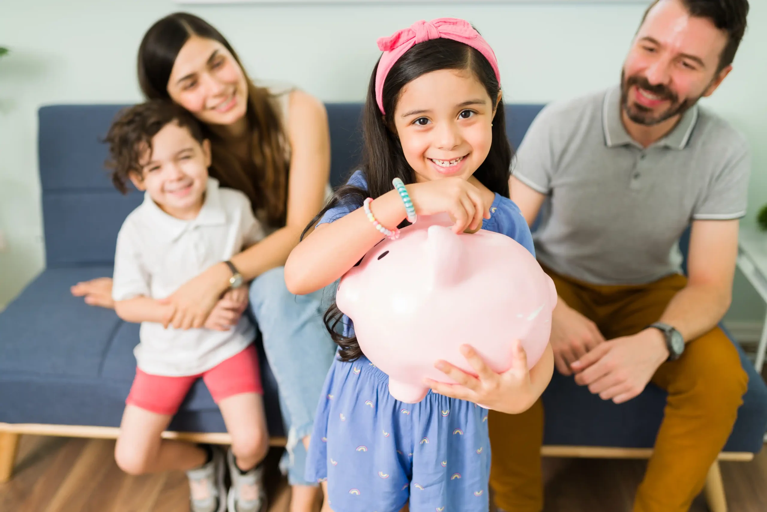 portrait cute little girl putting money pink piggy bank save new toy her her small brother scaled