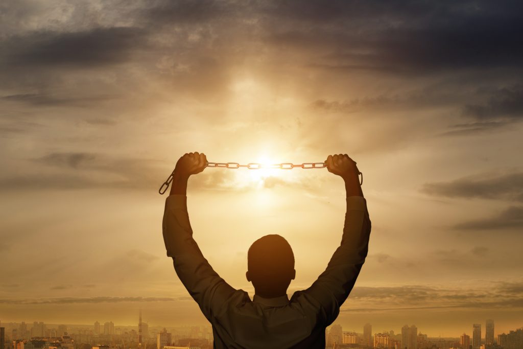 man holding chain background sunny sunset 1